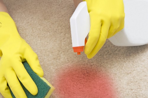 Carpet cleaning team preparing equipment safely for a job
